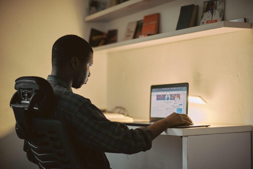 Man updating professional profile for jobs in Kenya